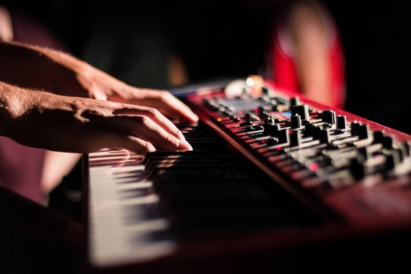 Someone playing a keyboard